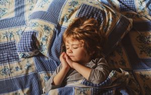 bigstock cute child sleeping in the bed 451476897