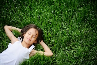 bigstock happy child enjoying on grass 47373916
